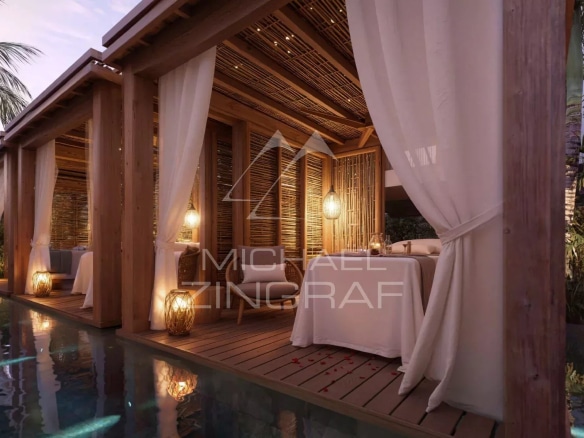 Espace de bien-être avec cabines de massage en bois et piscine à Grand Baie.