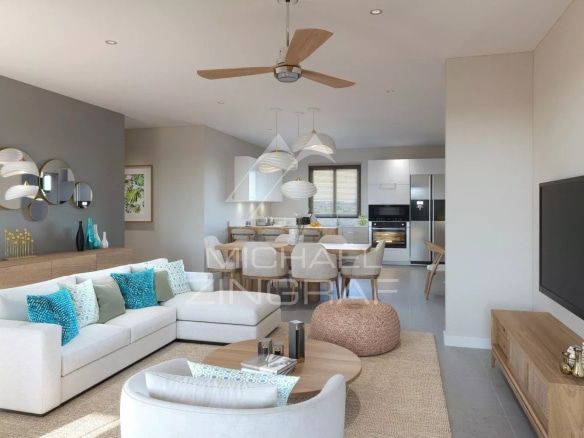 Intérieur d'un penthouse moderne avec salon lumineux et cuisine ouverte à Grand Baie.