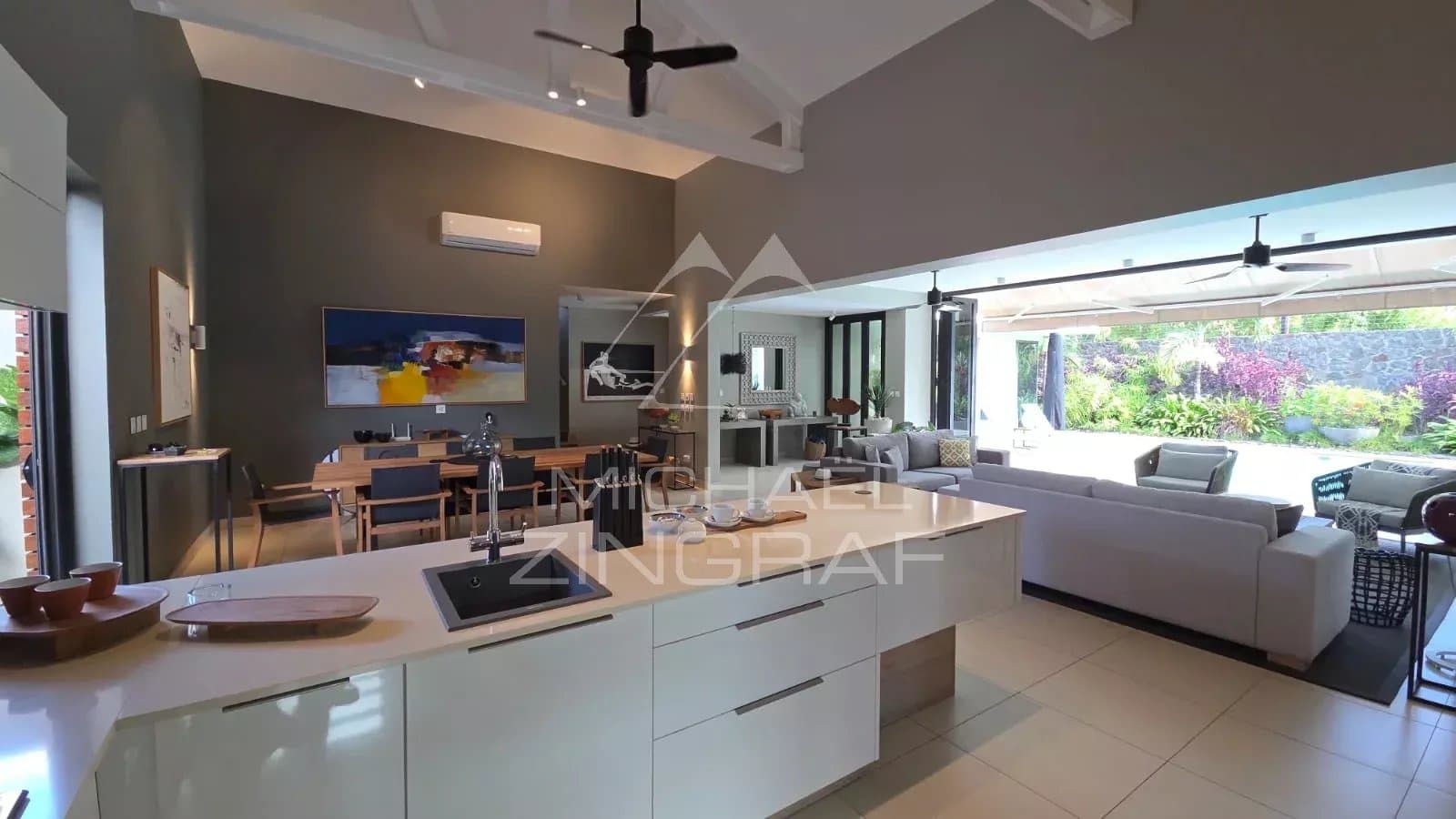 Interior of a contemporary villa in Pereybère with modern kitchen and bright living room.