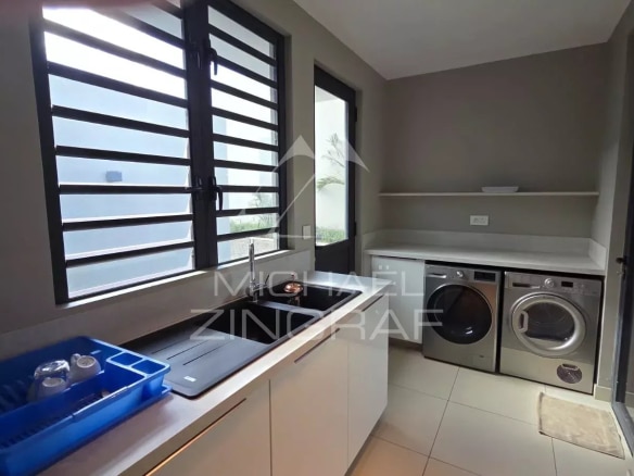 Interior of a modern kitchen with household appliances in Pereybère.