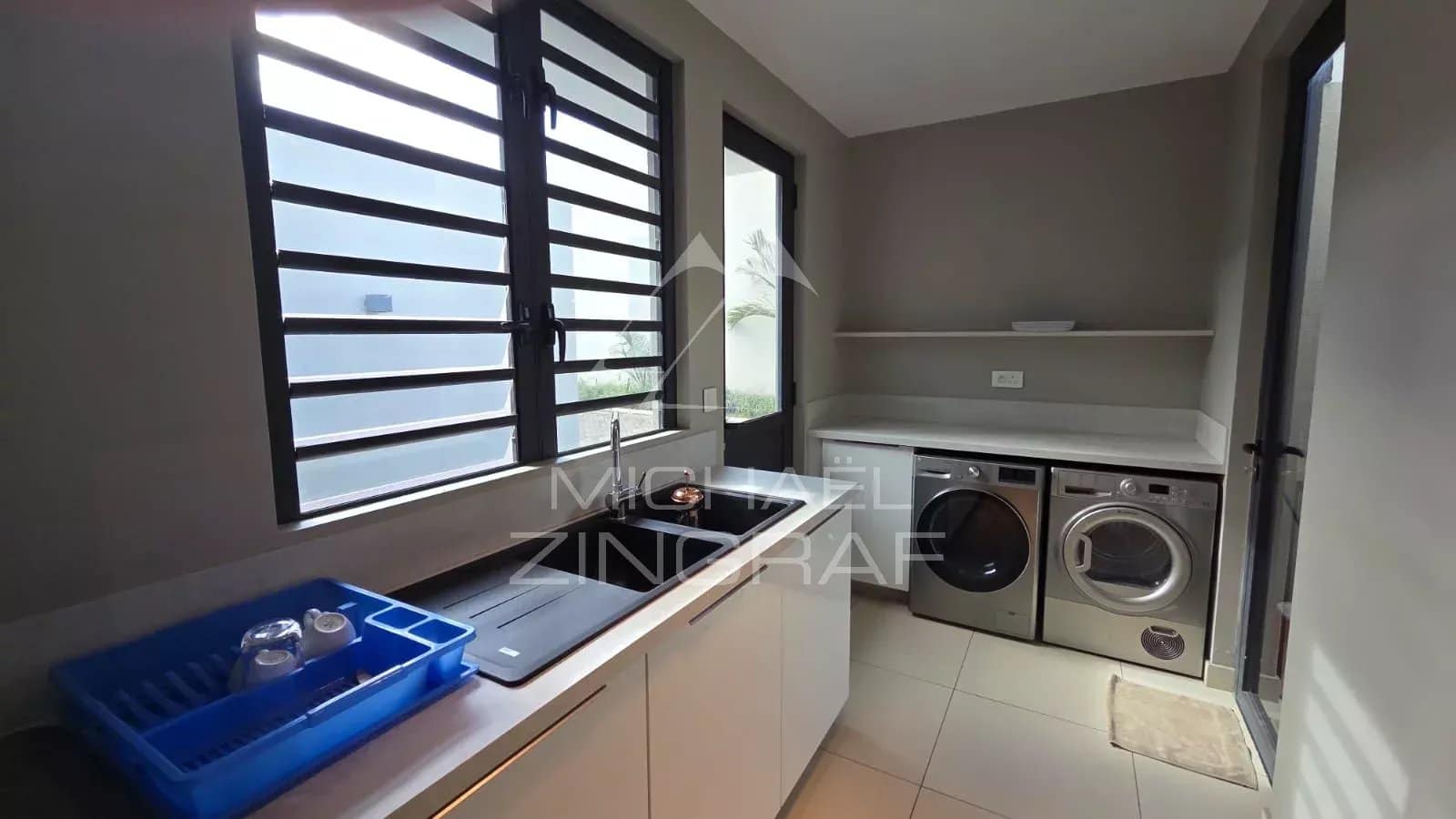 Interior of a modern kitchen with household appliances in Pereybère.