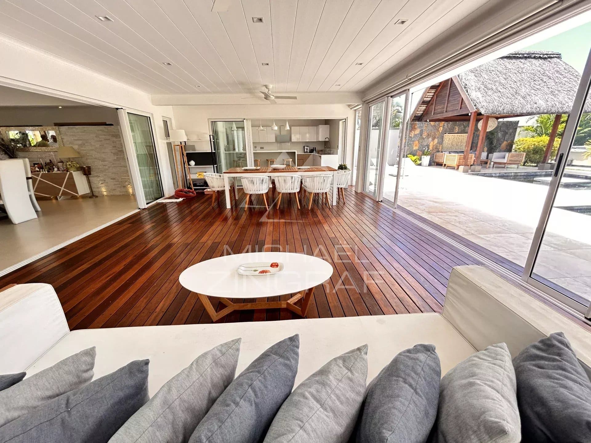 Interior of a modern villa in Grand Baie with a bright living room and an open kitchen.