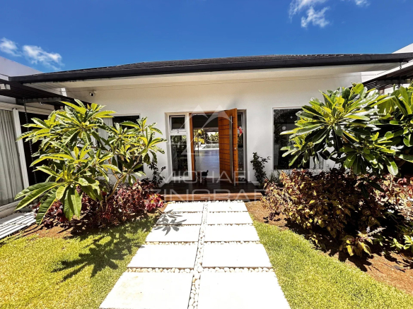 Modern villa with lush garden in Grand Baie, Mauritius.