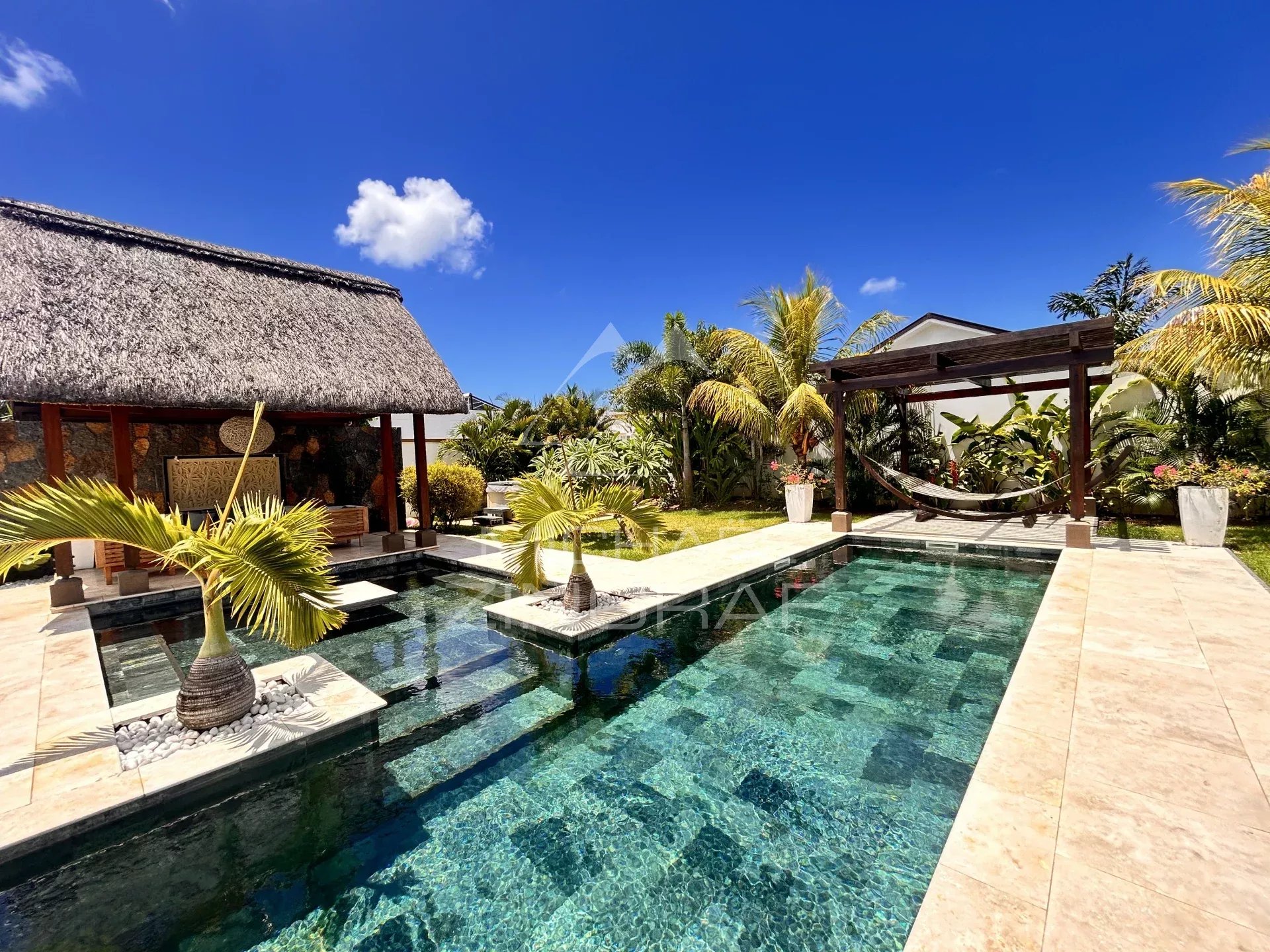 Villa with swimming pool and lush garden in Grand Baie, Mauritius.