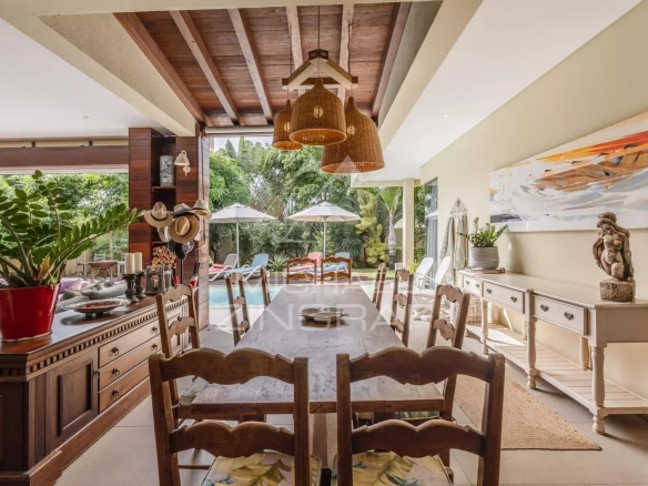 Interior of a villa in Mont Mascal, Grand Baie, with dining room and access to the swimming pool.
