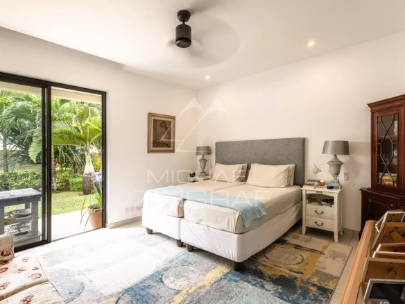 Room in a villa in Mont Mascal, Grand Baie, with bed, furniture and access to a garden.