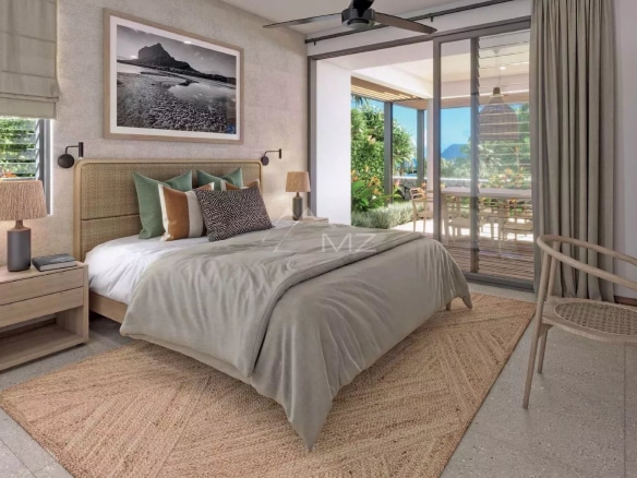 Chambre d'une villa avec vue sur l'océan à Rivière Noire, décorée avec des éléments modernes et lumineux.