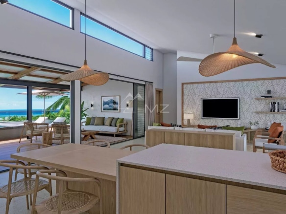 Intérieur d'une villa moderne avec vue sur l'océan à Rivière Noire, mobilier contemporain et grandes baies vitrées.