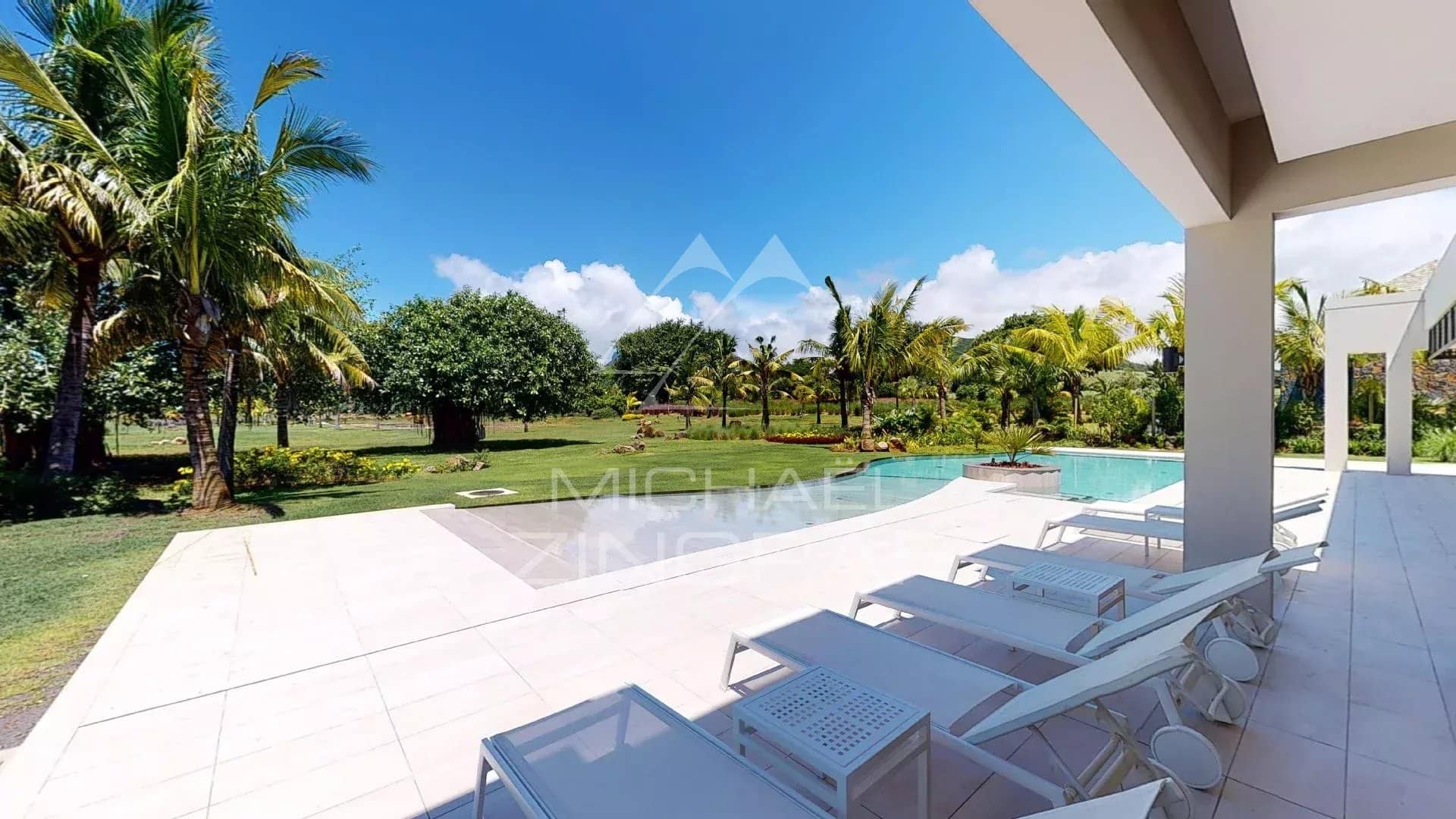 Modern villa in Beau Champ Exterior view of a modern villa with swimming pool and garden in Beau Champ, Mauritius.