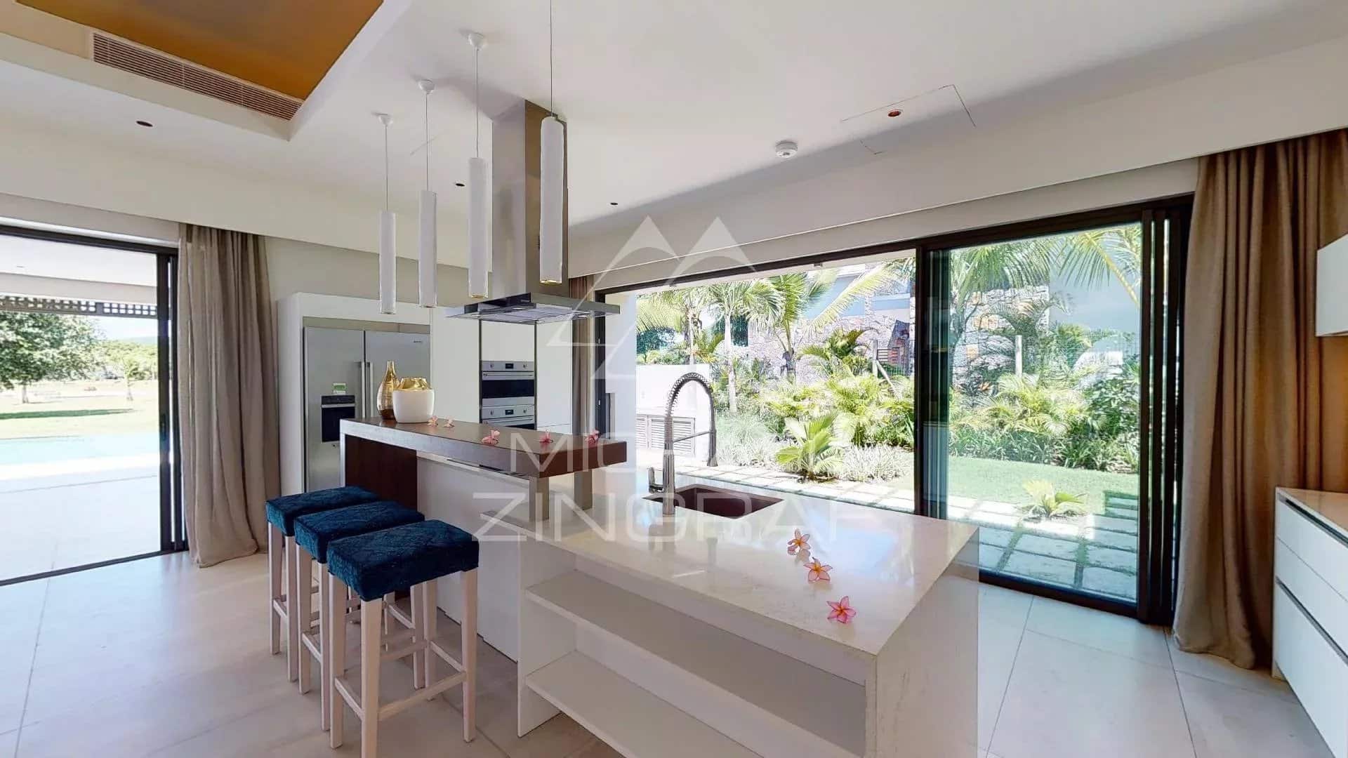 Modern kitchen in a villa in Beau Champ Modern kitchen with central island and bay windows overlooking the garden in a villa in Beau Champ, Mauritius.