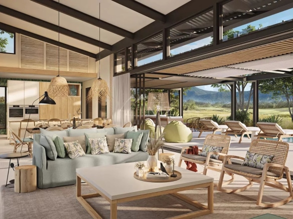 Intérieur d'une villa moderne avec salon lumineux et vue sur le golf à Rivière Noire, Île Maurice.