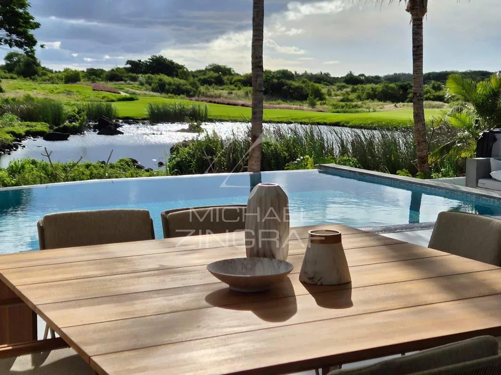 View of the private pool and outdoor space of a contemporary villa in Mon Choisy Golf, Grand Baie.