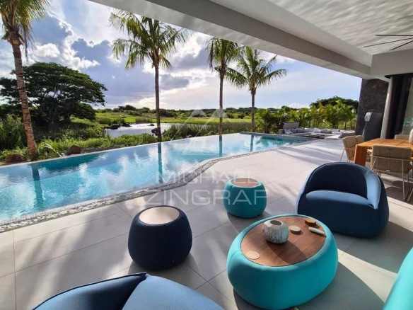 View from the terrace of a contemporary villa with swimming pool and modern furniture in Mon Choisy Golf, Grand Baie.
