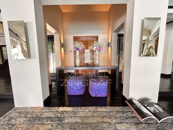 Interior of a villa in Beau Champ with a decorated counter and flowers.