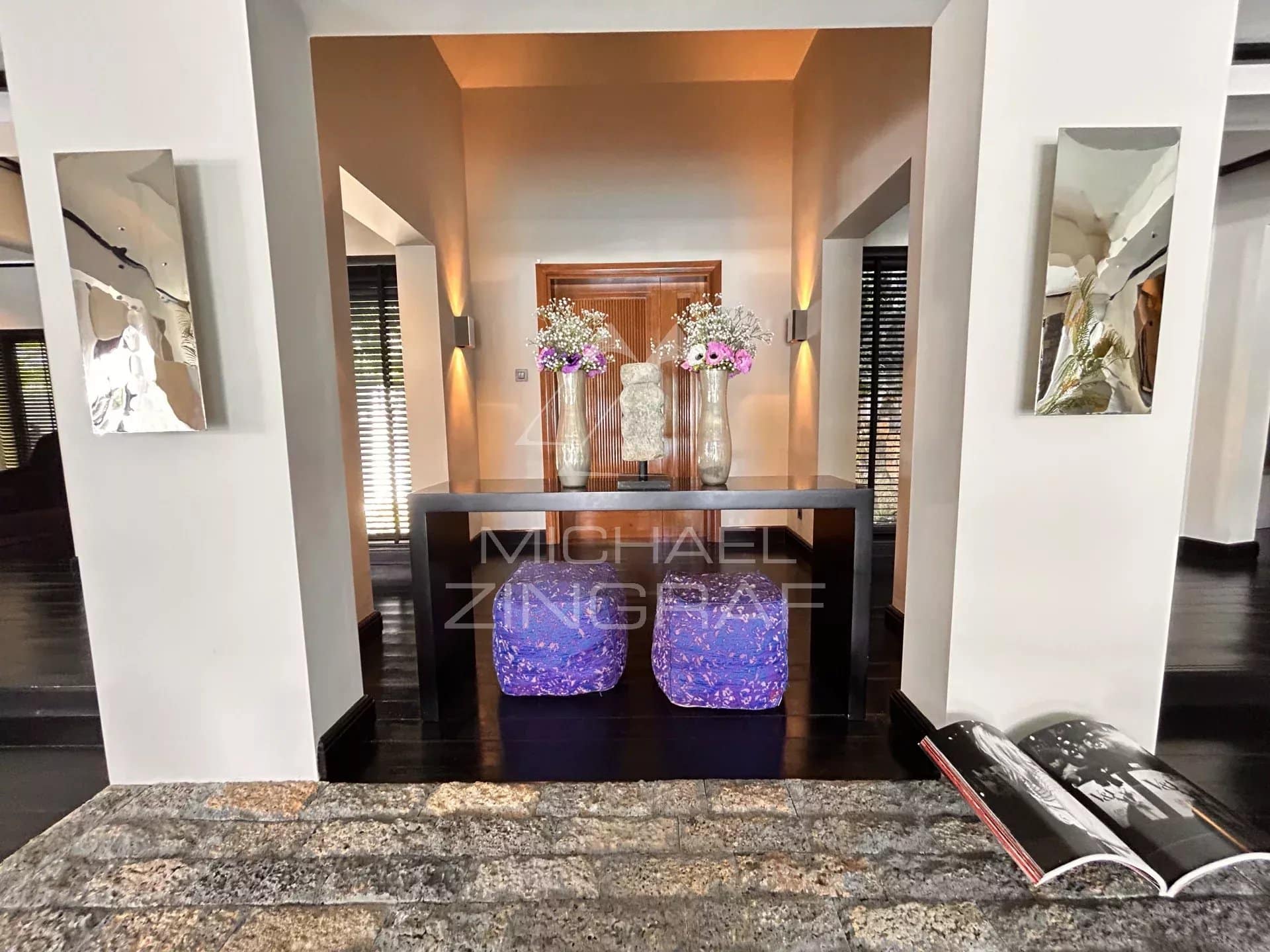 Interior of a villa in Beau Champ with a decorated counter and flowers.