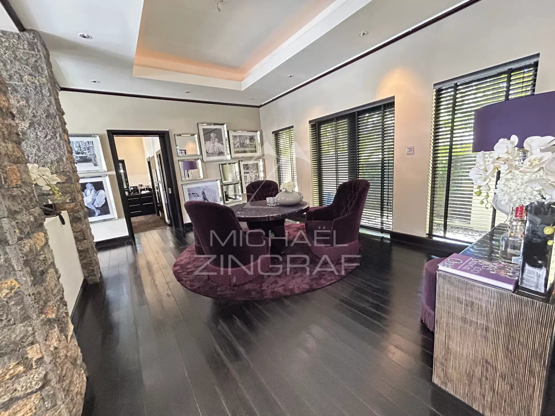 Interior of a villa in Beau Champ with an elegant dining area and movie-inspired decorations.