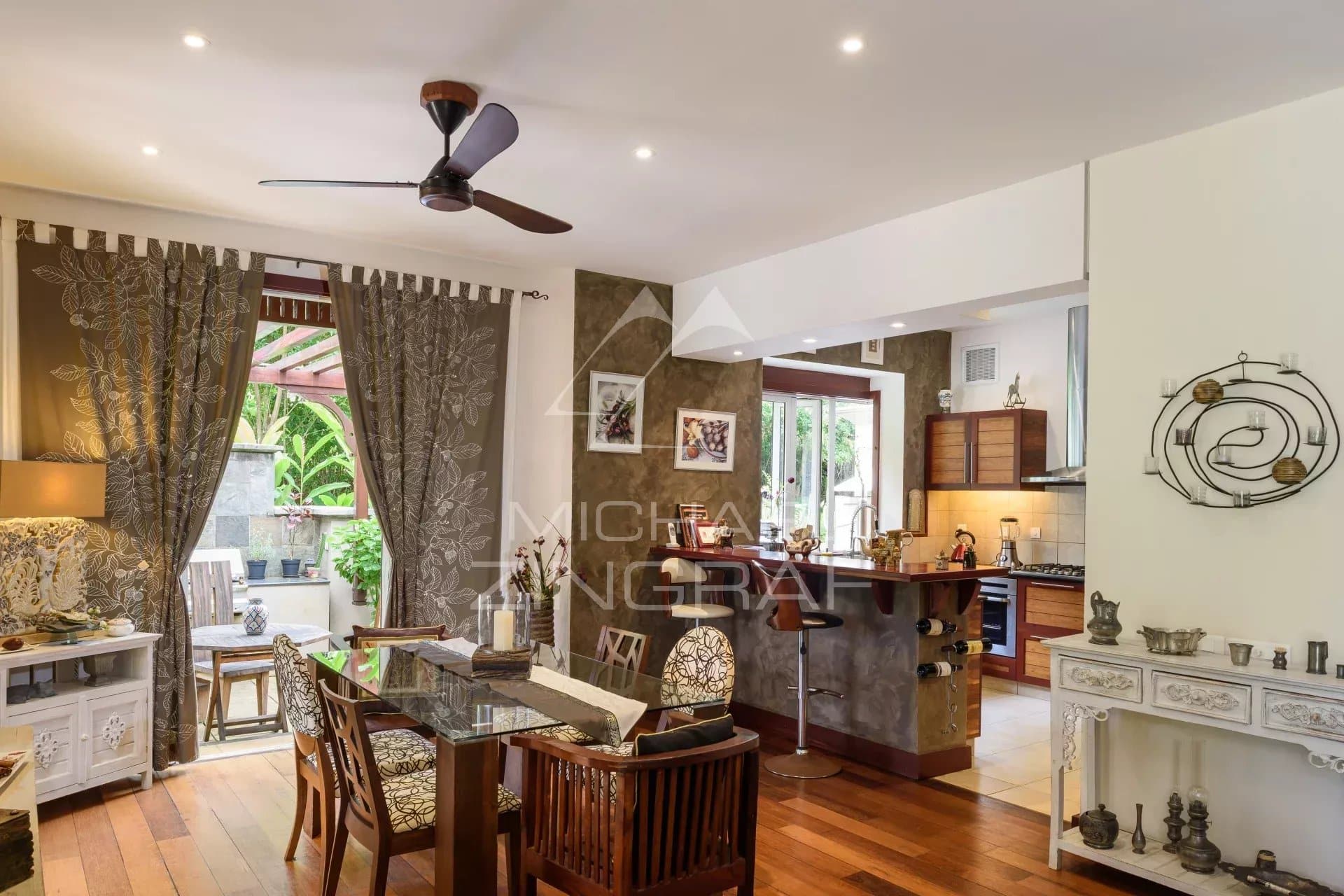 Interior of a villa in Bel Ombre, Mauritius, with modern living room and kitchen.