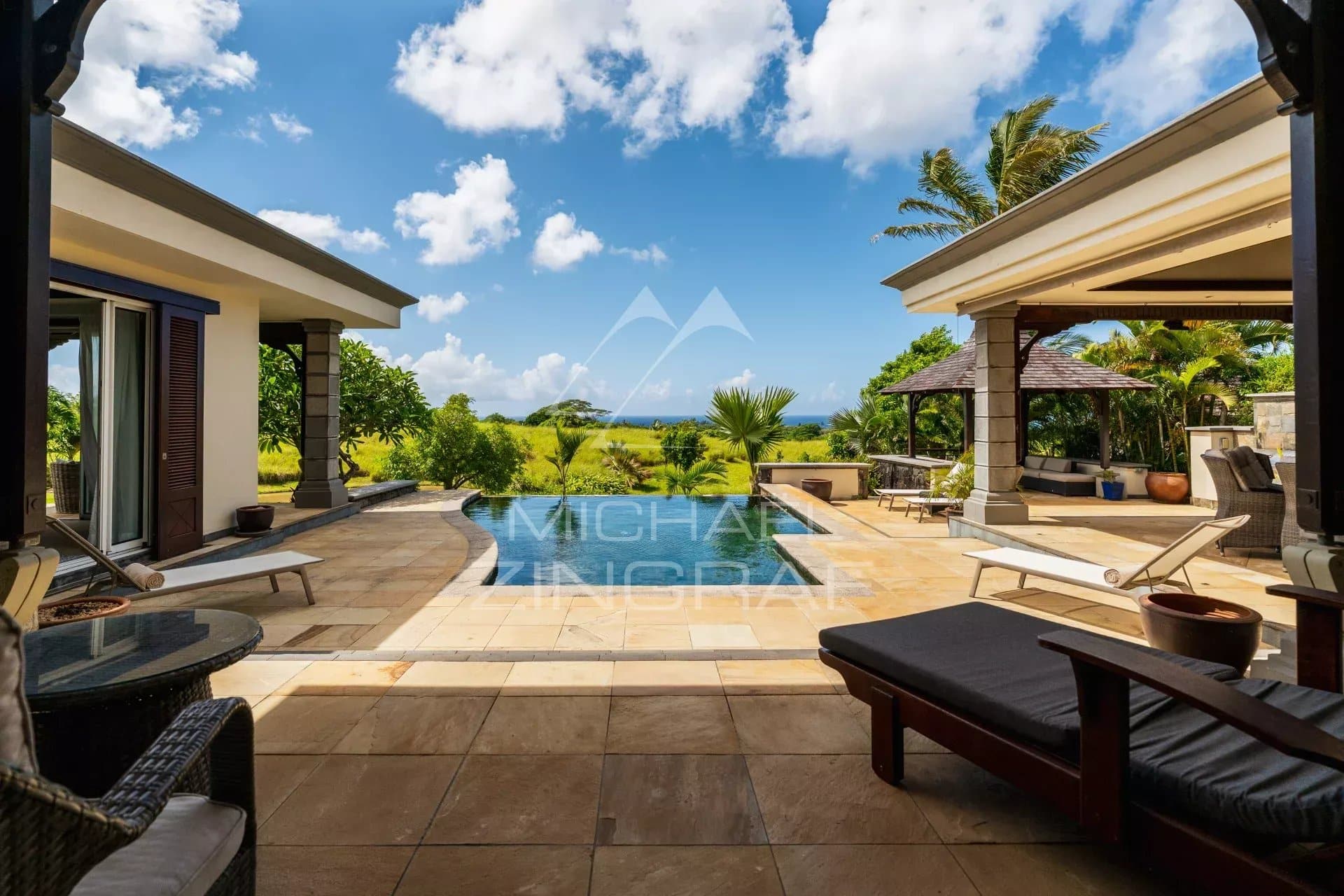 Villa in Bel Ombre with swimming pool and ocean view in a green setting.