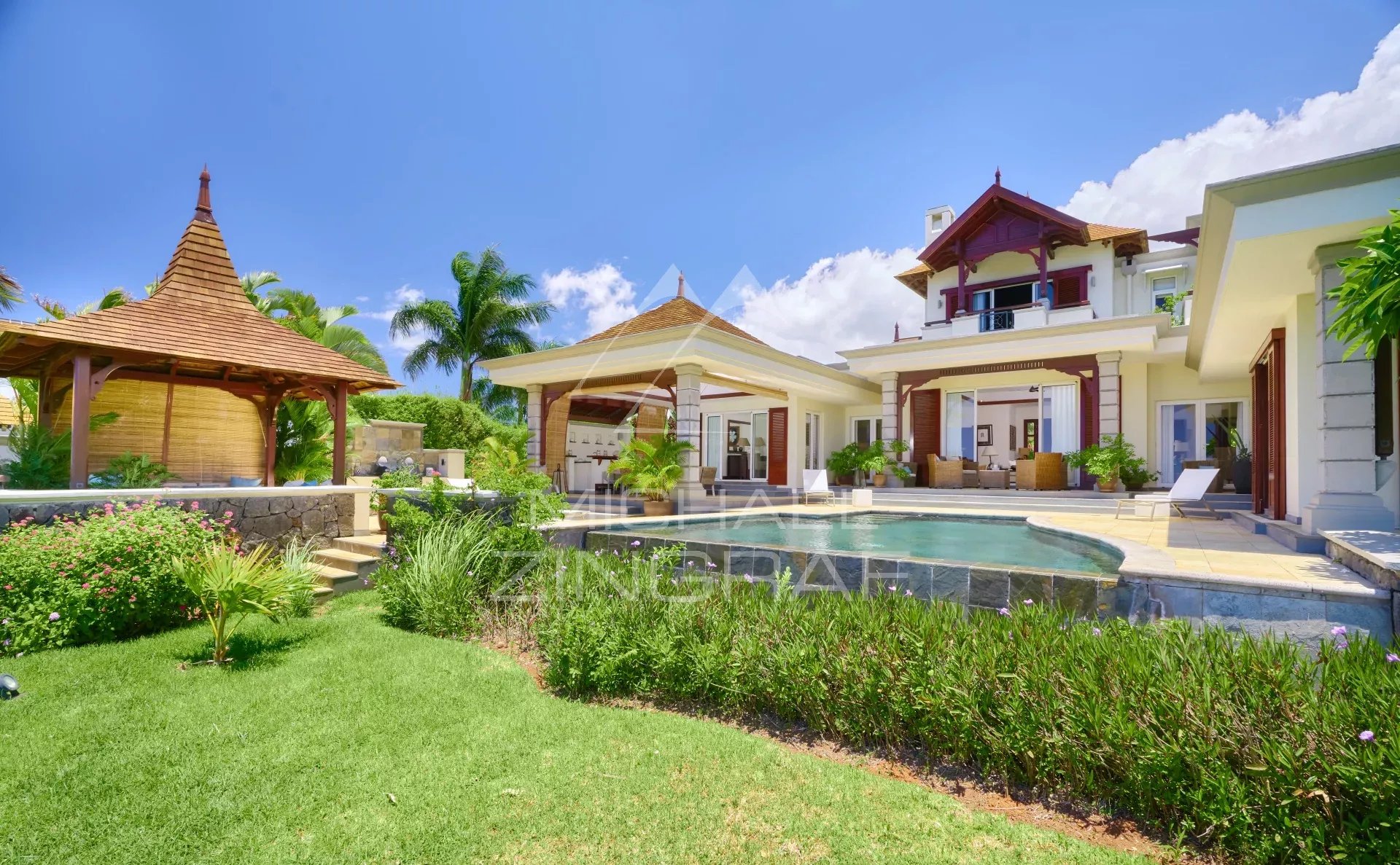 Two-story villa with pool and garden in Bel Ombre, Mauritius, with ocean views.