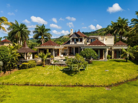 Elegant two-story villa with ocean views and a lush garden in Bel Ombre, Mauritius.