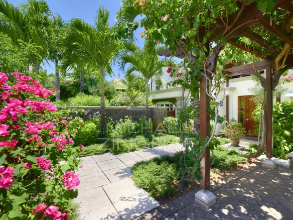 Elegant villa with flower garden and sea view in Bel Ombre, Mauritius.