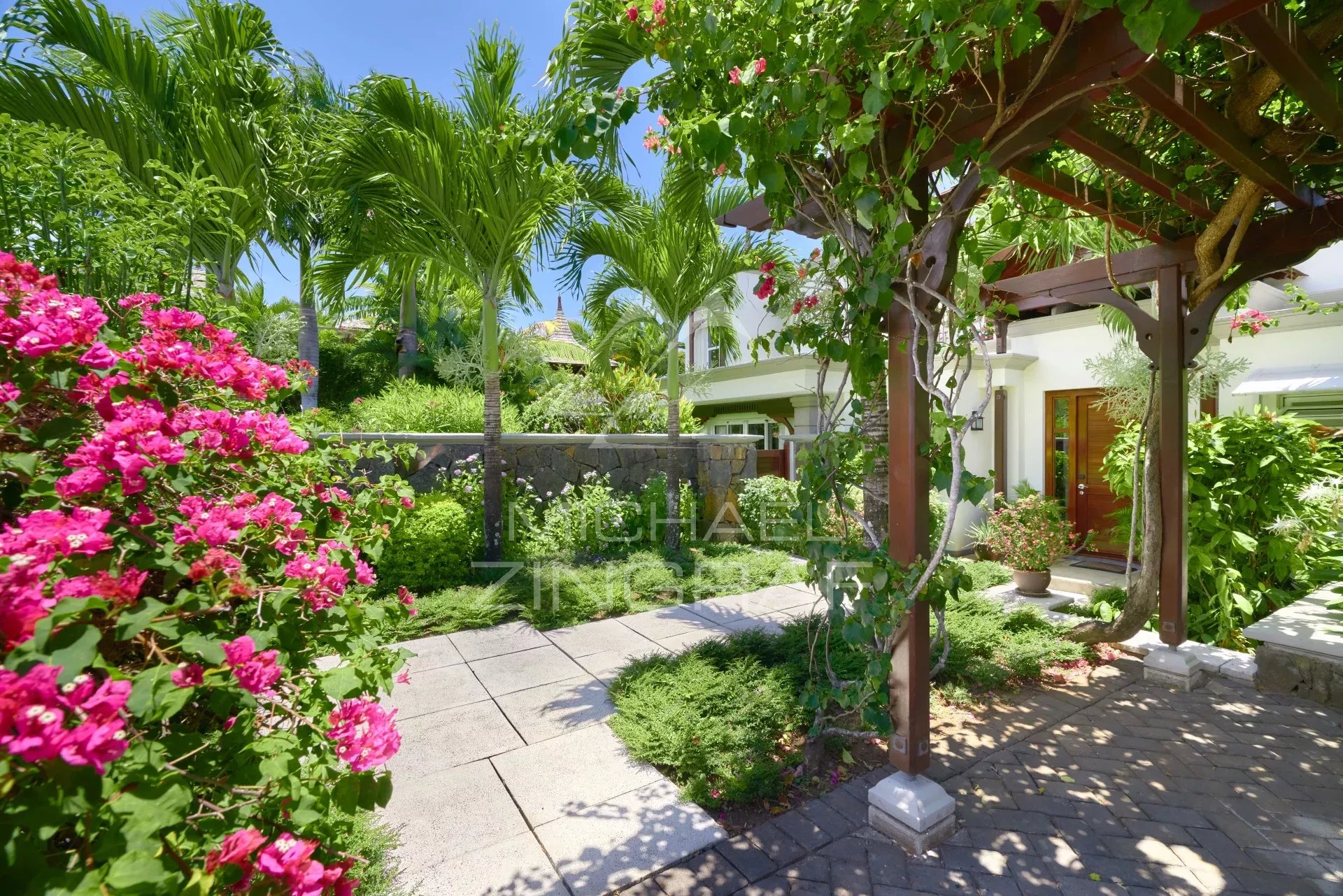 Elegant villa with flower garden and sea view in Bel Ombre, Mauritius.