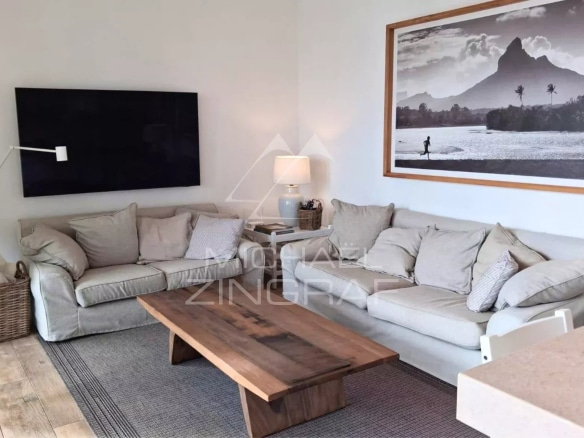 Living room of an apartment with sofa and coffee table, decorated in a modern style.