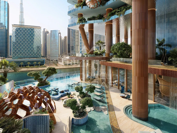 Vue d'une résidence moderne avec piscine et jardins, face au Burj Khalifa à Dubai.