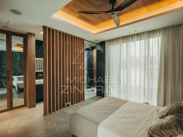 Modern room with bed, designer lighting and wooden walls, view of the outside.