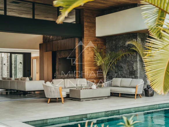 Interior of a modern villa with living room, swimming pool and contemporary decor.