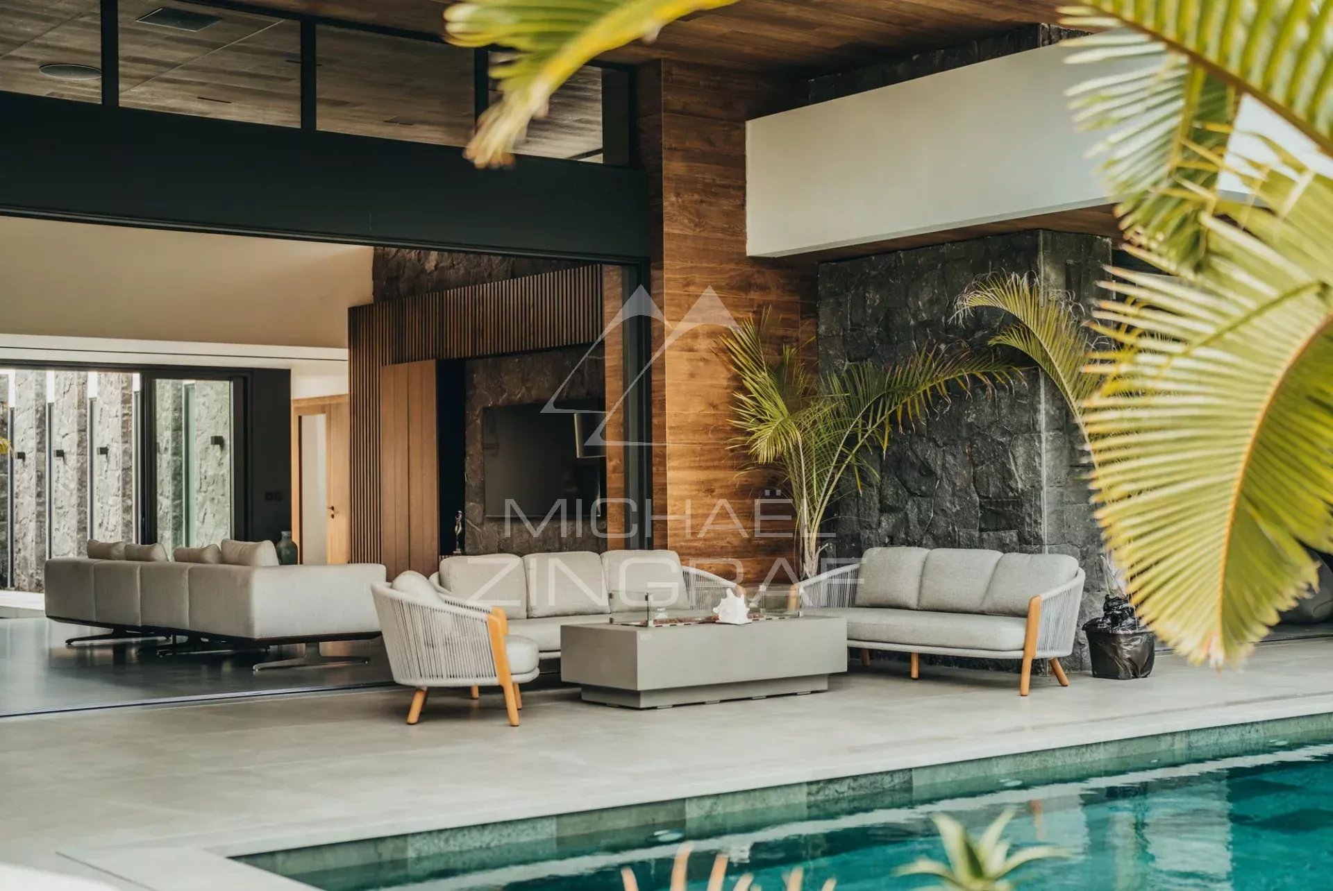 Interior of a modern villa Interior of a modern villa with living room, swimming pool and contemporary decor.