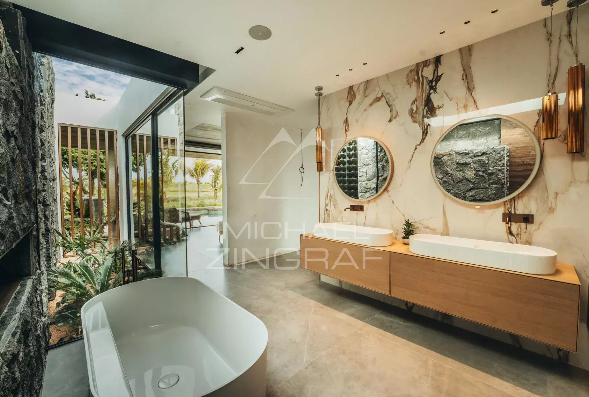 Contemporary bathroom Modern bathroom with bathtub and sinks, natural lighting, view of the outside.