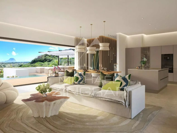 Intérieur moderne d'une villa avec vue sur l'océan et les montagnes, salon spacieux et cuisine ouverte.