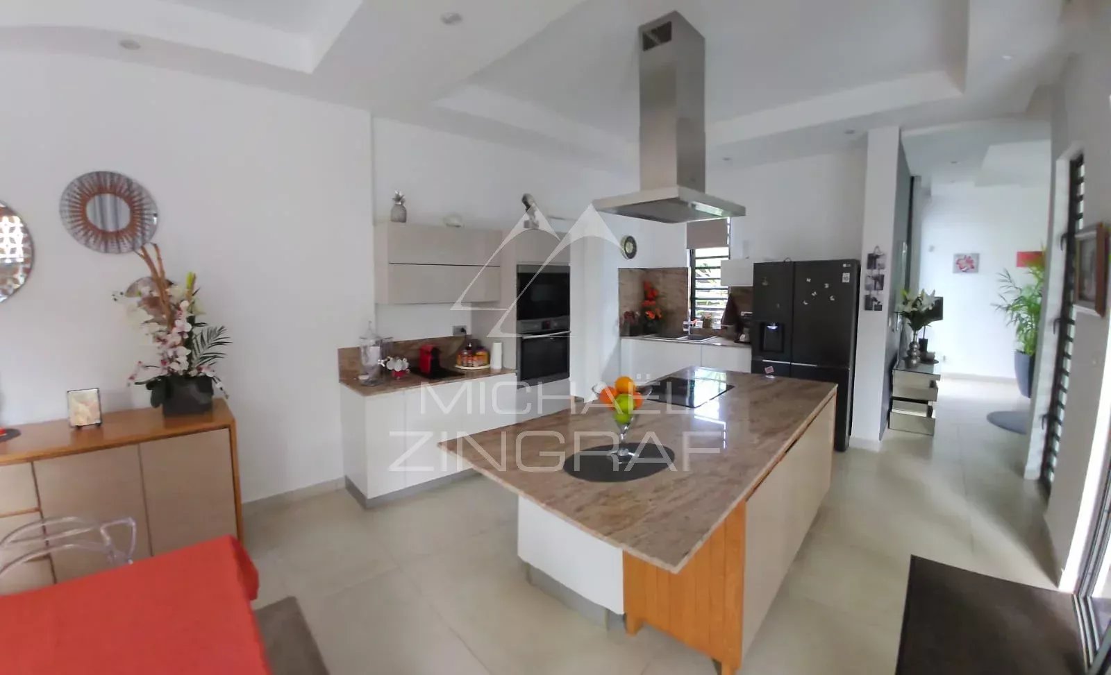 Interior of a villa in Pereybère Interior of a modern villa in Pereybère with open kitchen and bright living room.