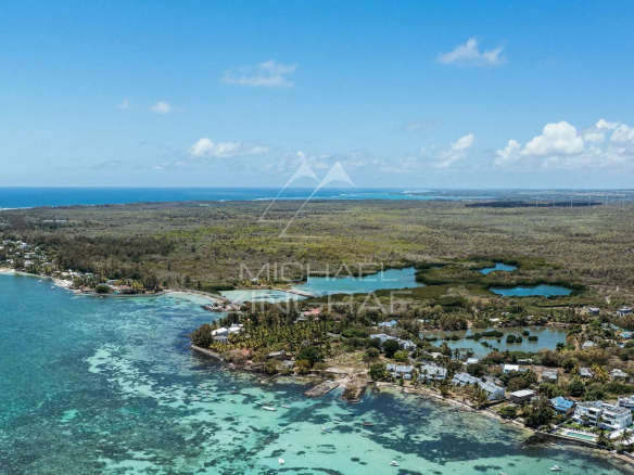 Aerial view of Roches Noires with lagoon and lush vegetation.