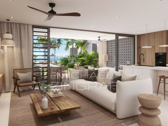 Interior of a modern apartment with living room and open kitchen, sea view in Roches Noires.