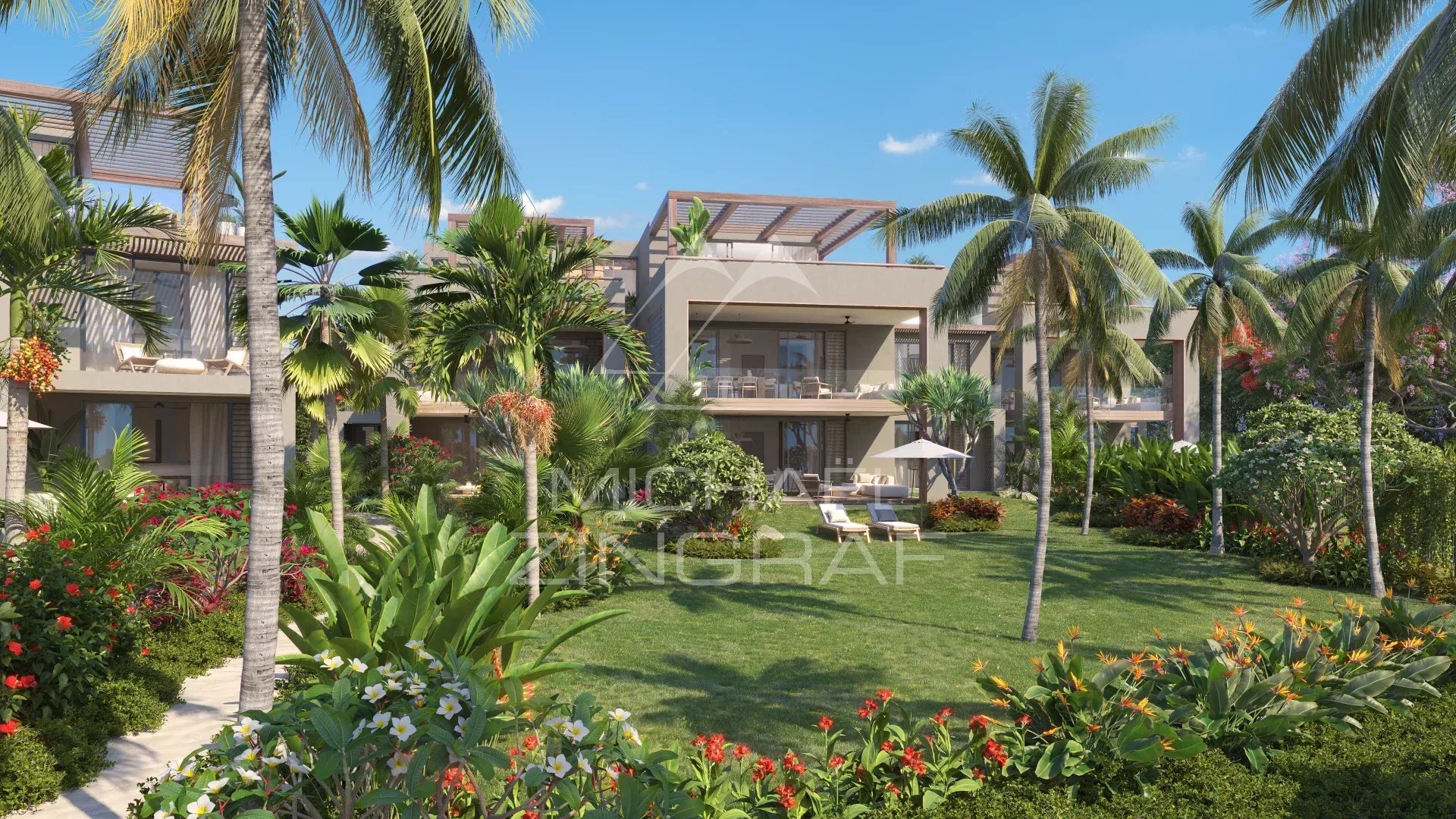 View of a ground floor apartment with garden and palm trees in Roches Noires.