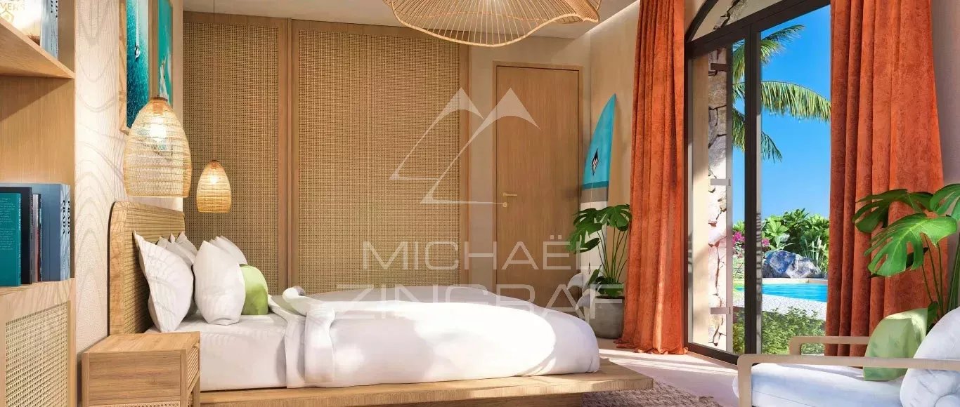 Chambre de villa bioclimatique à Baie du Cap Chambre d'une villa bioclimatique avec vue sur la piscine et le jardin tropical à Baie du Cap.