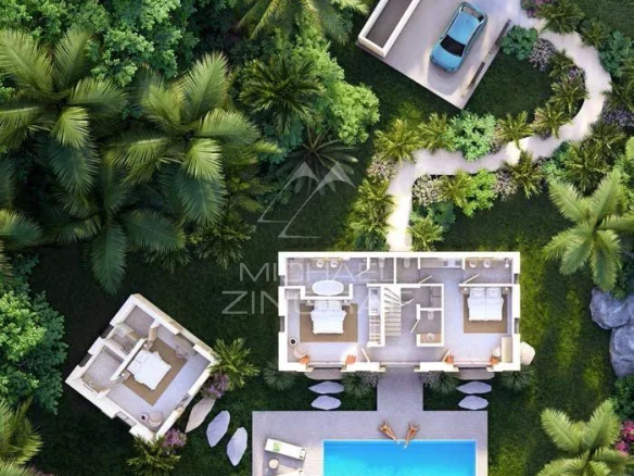 Aerial view of a bioclimatic villa with private pool surrounded by greenery in Baie du Cap.