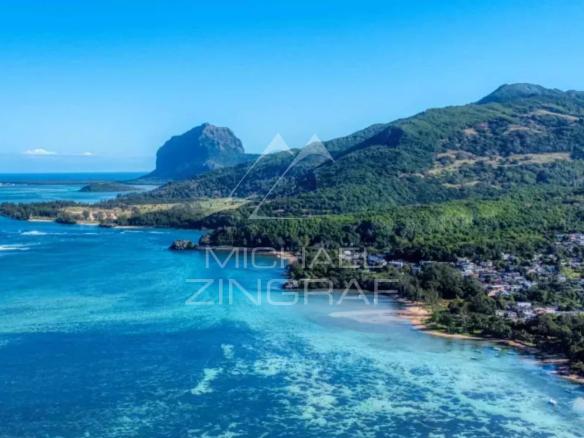 Panoramic view of Cape Bay with turquoise sea and mountains in the background.