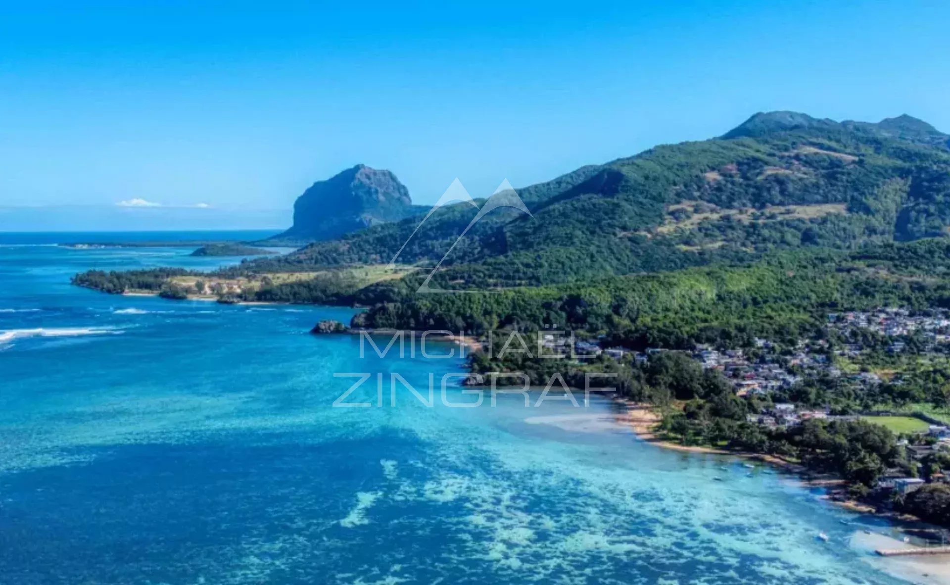 View of Cape Bay Panoramic view of Cape Bay with turquoise sea and mountains in the background.