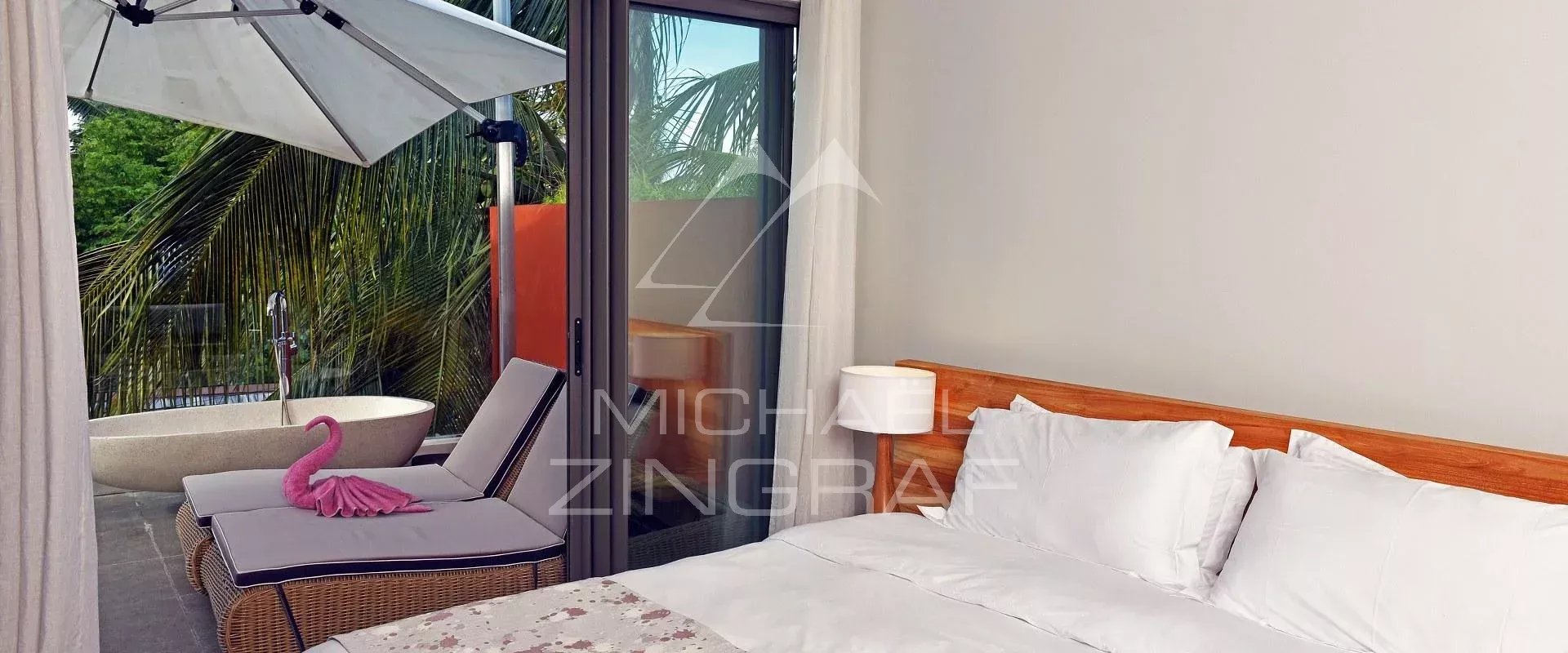 Apartment room in Pereybere Room in an apartment with bed, armchairs and terrace, sea view in Pereybere.