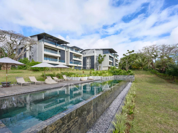 View of a modern apartment with swimming pool and green spaces in Belle Vue Harel.