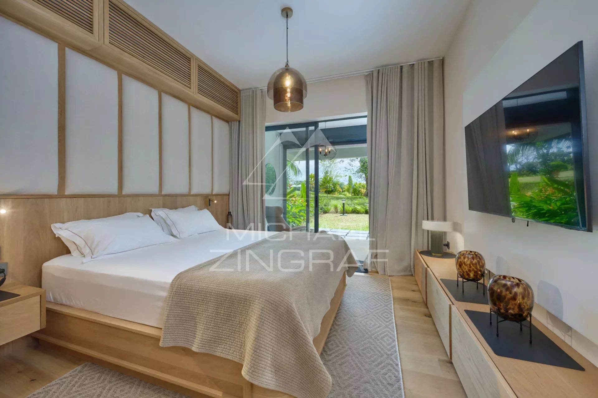 Apartment room with double bed and access to a private garden.