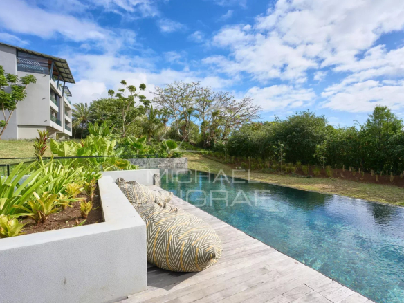View of a private garden with swimming pool and relaxation area, apartment in Belle Vue Harel.