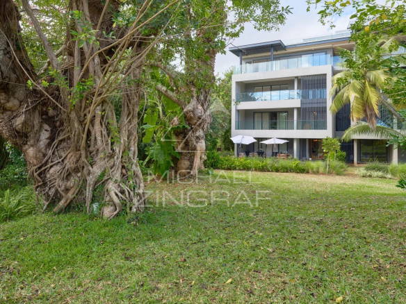 View of a modern apartment with private garden and trees in Belle Vue Harel.