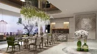 Intérieur d'un appartement à Dubaï avec salle à manger et cuisine ouverte, décor moderne.