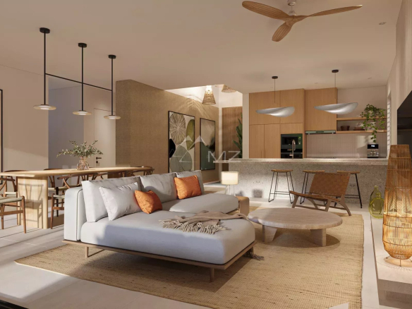 Interior of a luxury villa with a modern living room and open kitchen.