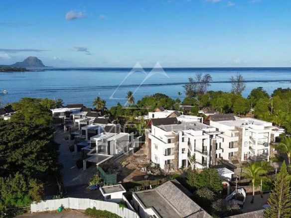 Aerial view of a luxury villa with swimming pool and access to the lagoon in Wolmar.
