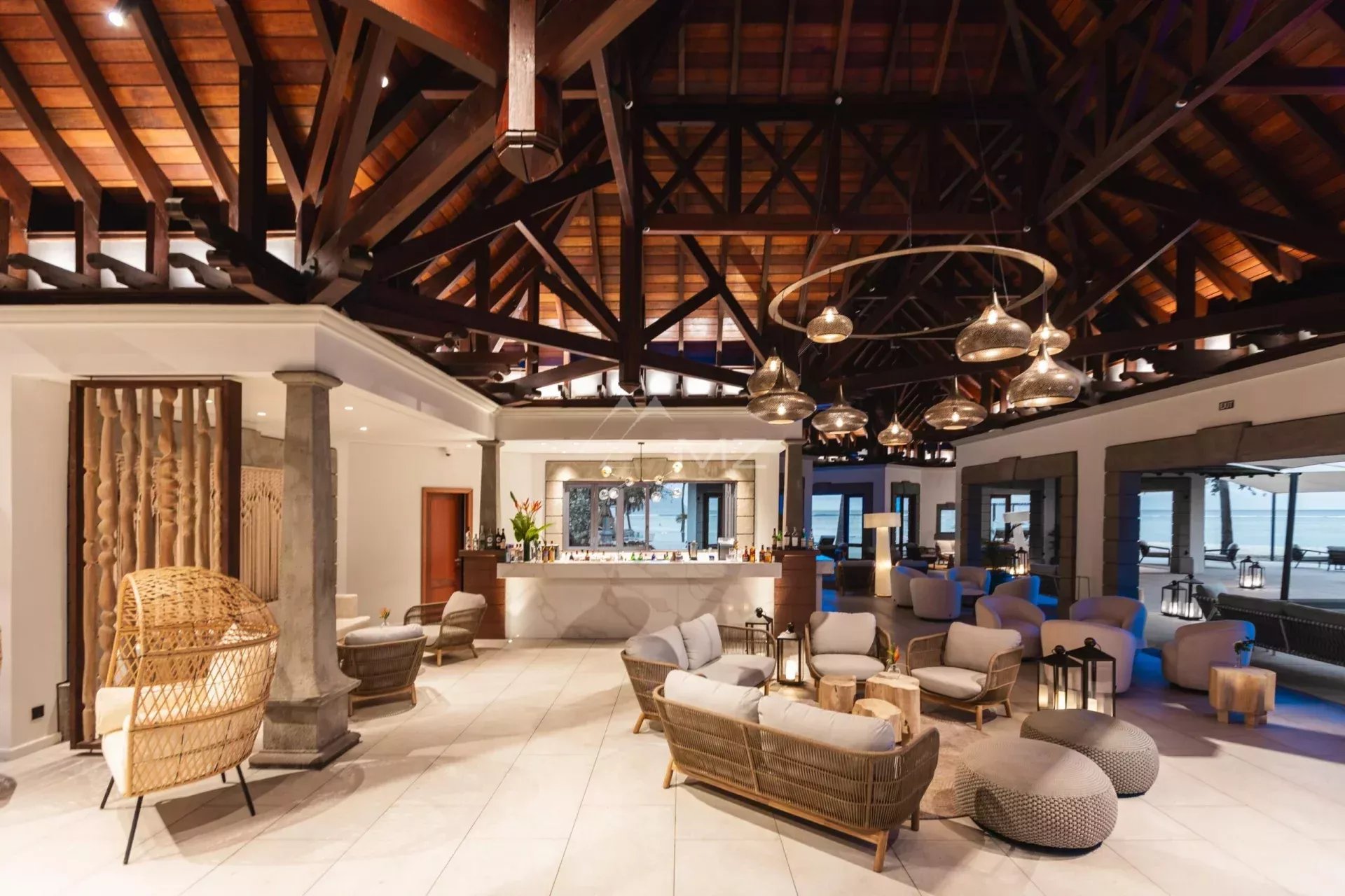 Interior of a luxury villa Interior of a luxury villa with a modern design and wooden ceiling, comfortable furniture and elegant lighting.